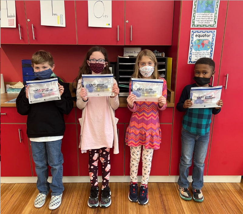 Milton Elementary second-graders (l-r) Owen Croce, McKinley Adams, Addie Yeich and Gabe WIdeman display their dental hygiene kits from Johnson Orthodontics.